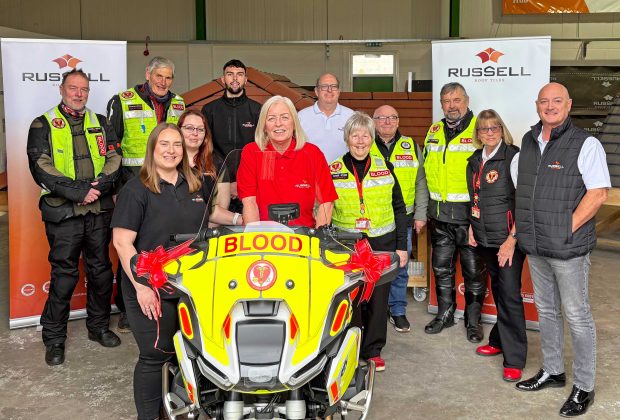 Russell-Roof-Tiles-Team-and-Charity-Members-with-New-Bike-1